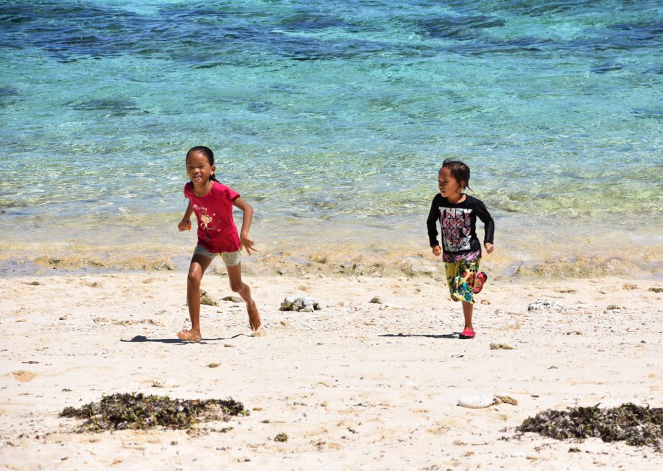 Kids playing at Bantigue Cove Beach